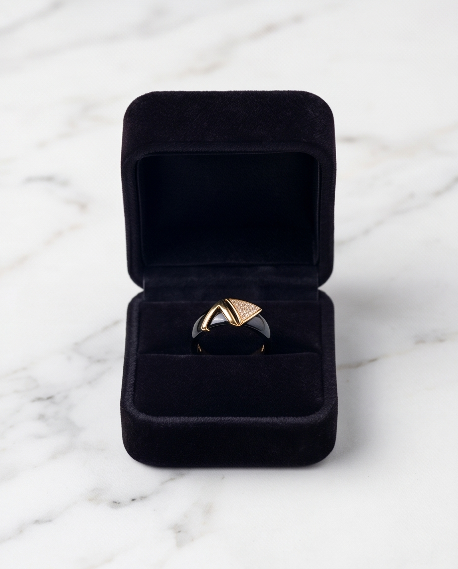 Avant black ceramic gold ring in black velvet gift box on marble, Stacked by Jayneebell
