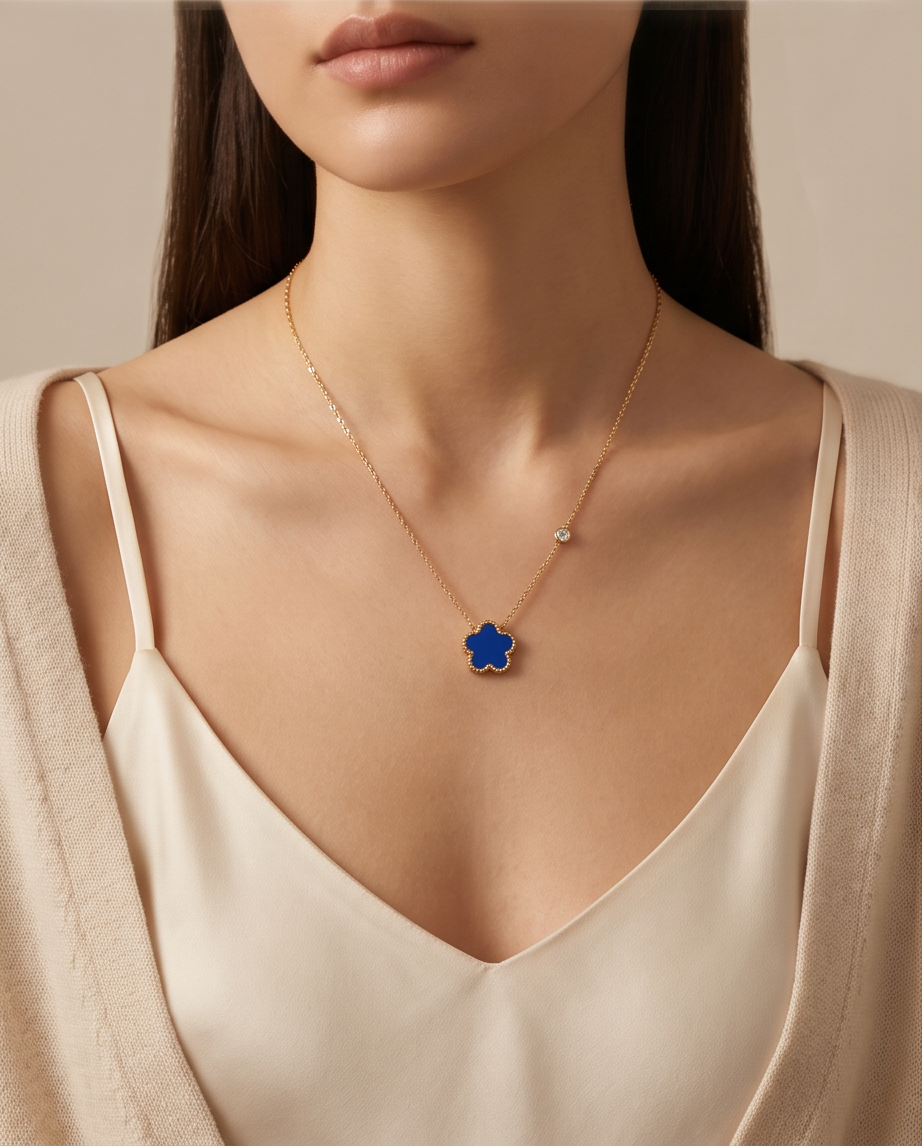 Model wearing Très Clove cobalt blue enamel flower necklace, Stacked by Jayneebell