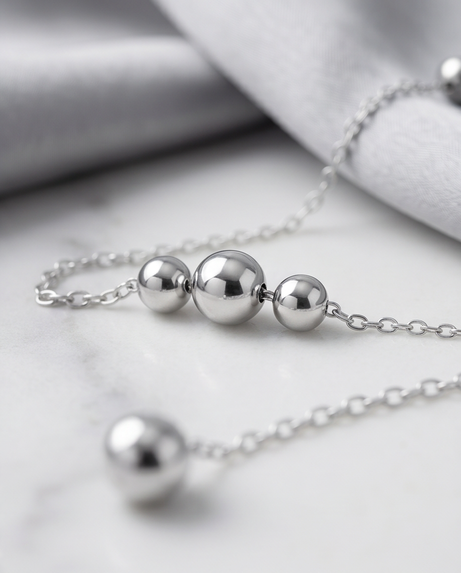 Close-up detail of Silver Lining double ball drop and satellite chain stations, Stacked by Jayneebell
