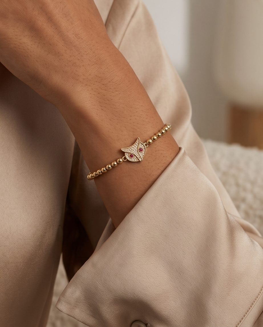 Gold plated owl charm bracelet styled on wrist — The Foxy Owl by Stacked by Jayneebell