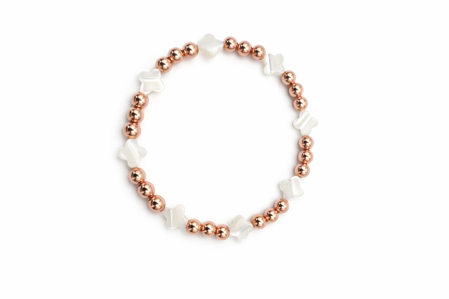 Bracelet with rose gold and white beads on a white background