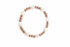 Bracelet with rose gold and white beads on a white background