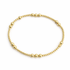 Gold beaded bracelet on a white background