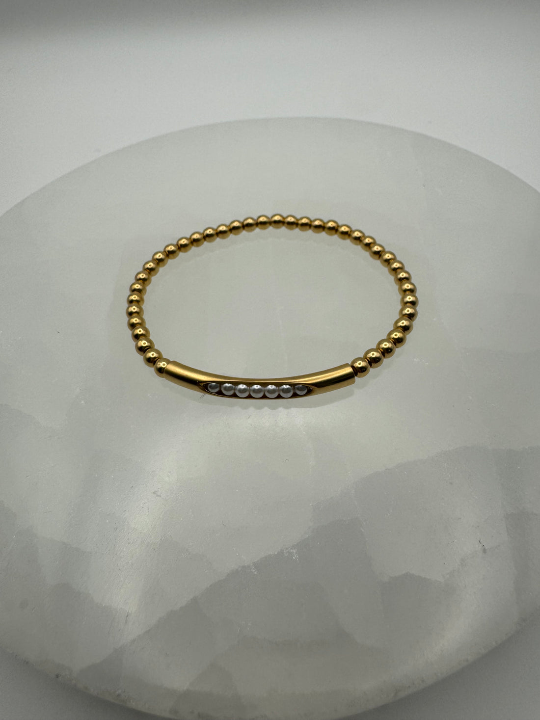 4mm 18k gold filled stretch beaded bracelet with pearl bar on stone surface