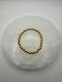 4mm 18k gold filled stretch beaded bracelet on stone surface