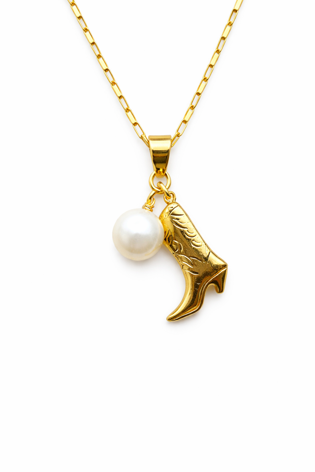 Gold necklace with a cowboy boot and pearl pendant on a white background