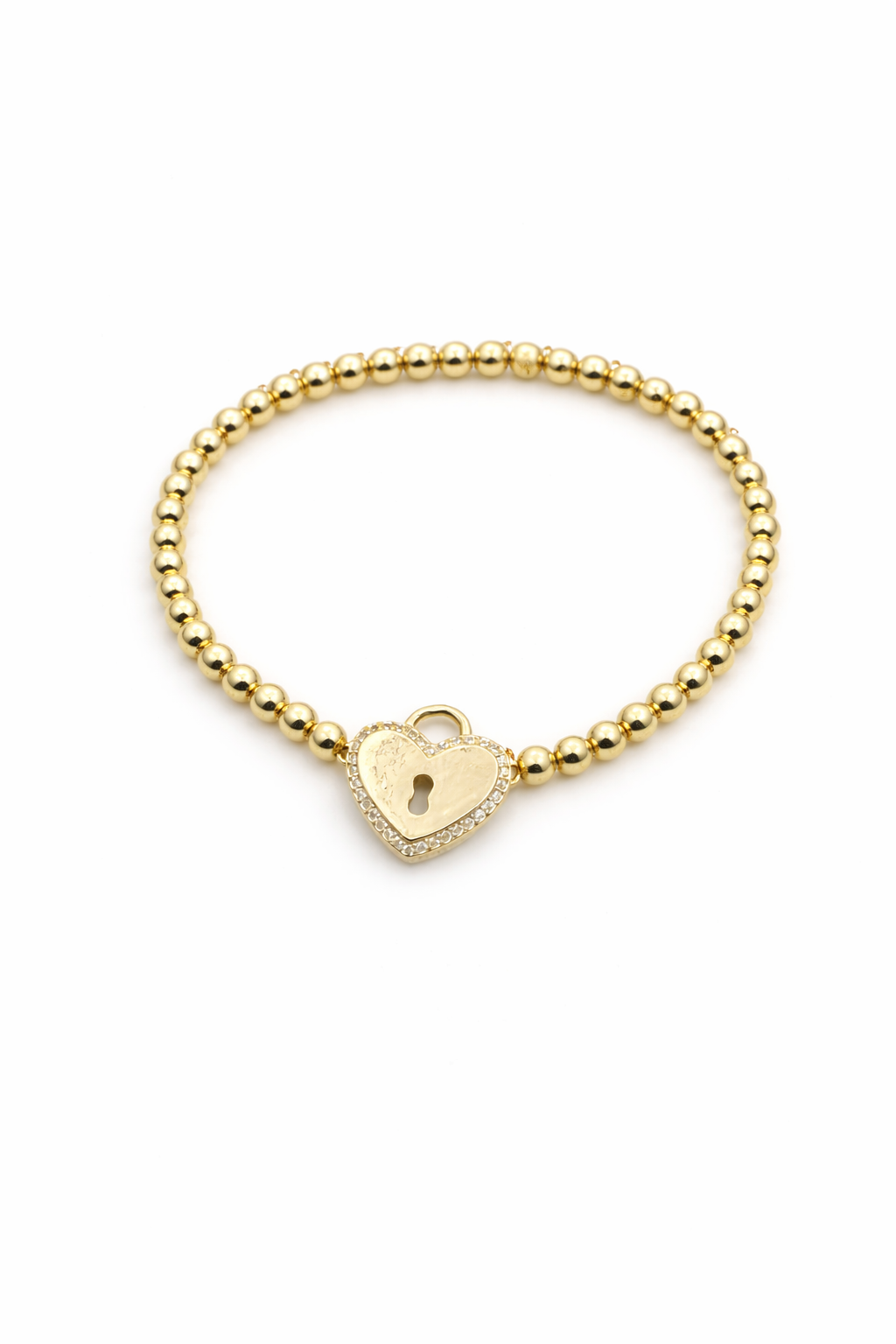 Gold beaded bracelet with a heart-shaped lock charm on a white background
