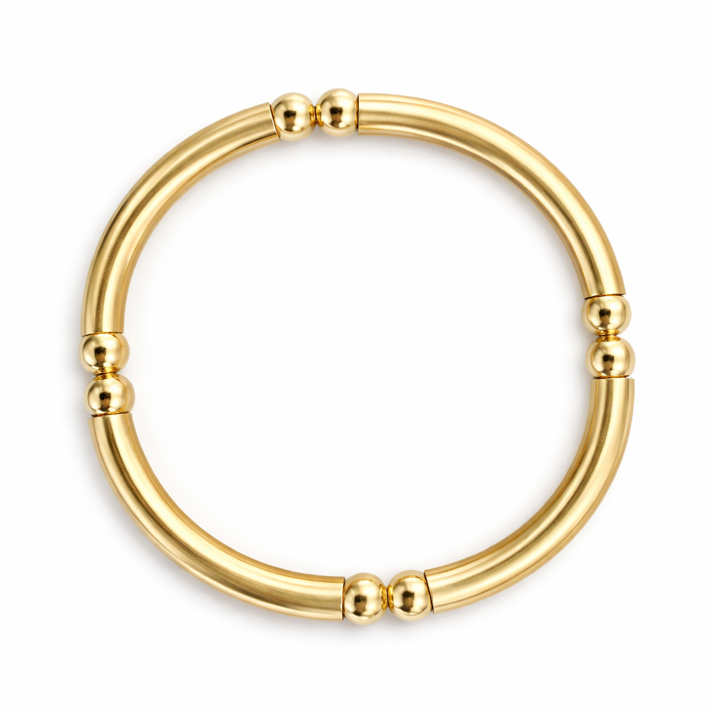 gold bangle bracelet on a white background