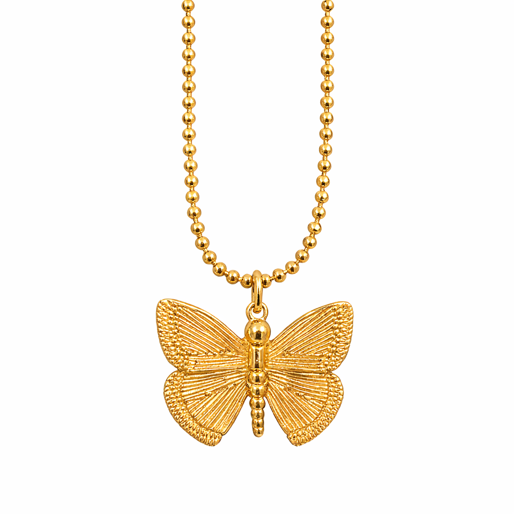 Gold butterfly pendant necklace on a white background