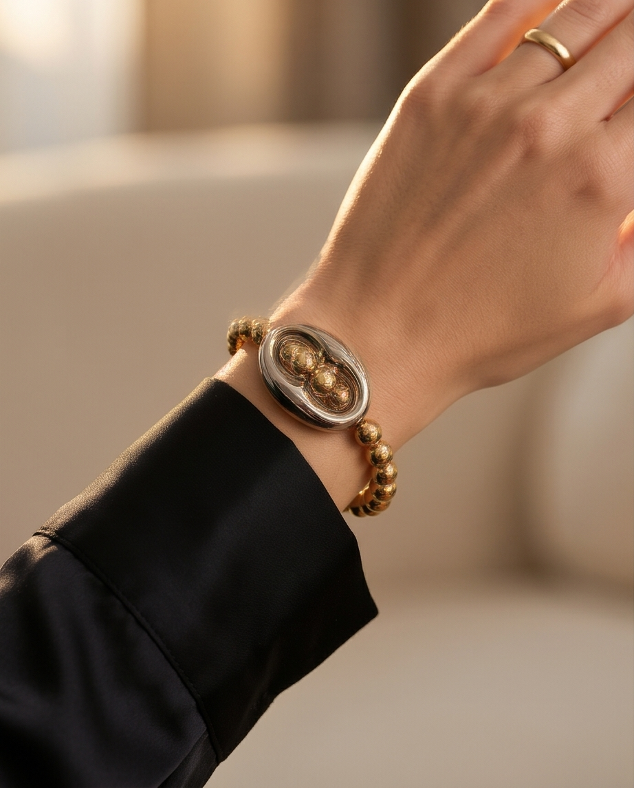 The Mariner gold filled bracelet worn on wrist with black blazer — Stacked by Jayneebell
