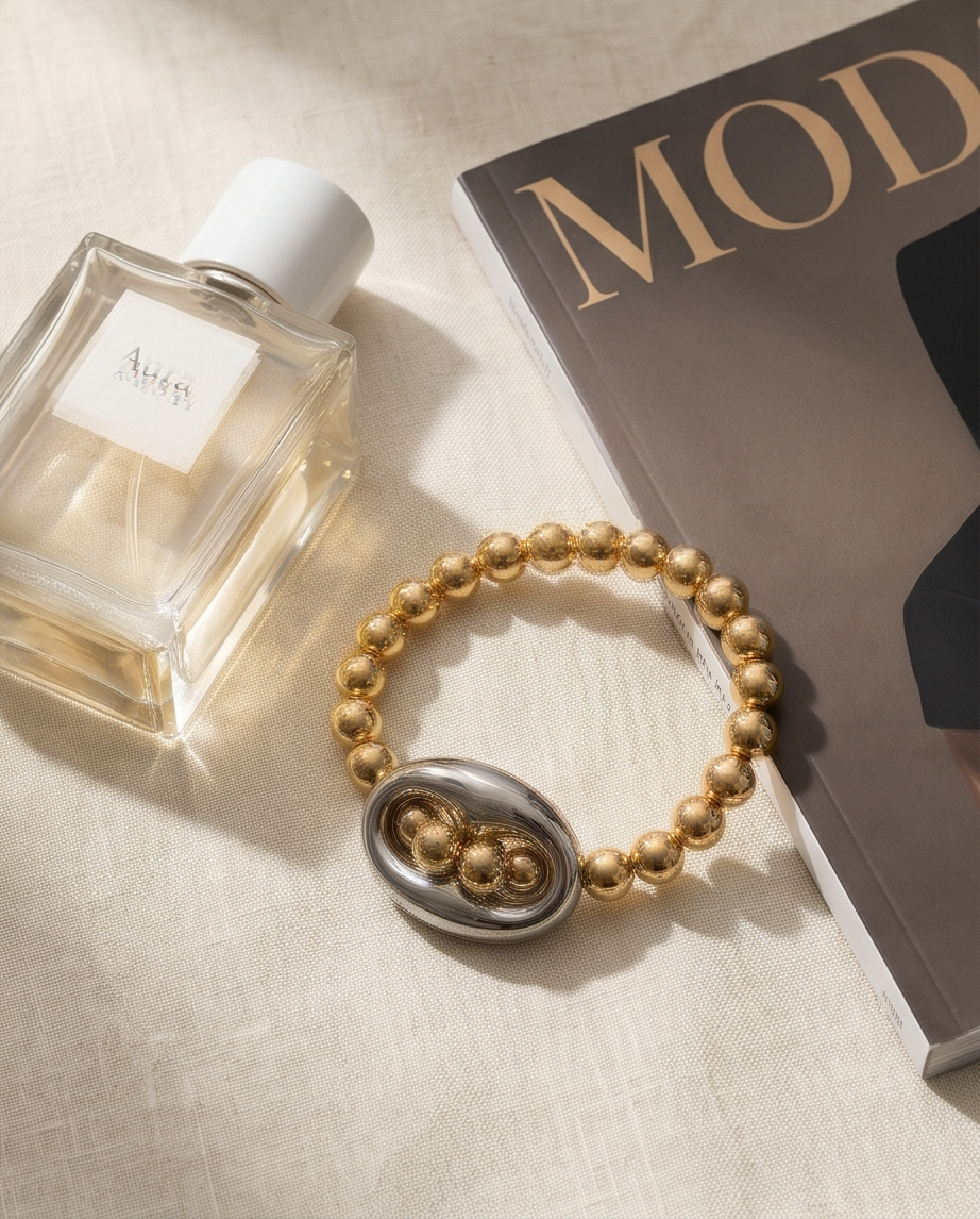 The Mariner bracelet styled with fashion magazine and perfume bottle — Stacked by Jayneebell
