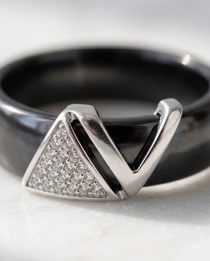 Close-up detail of Avant silver plated geometric V pavé CZ topper on black ceramic band, Stacked by Jayneebell
