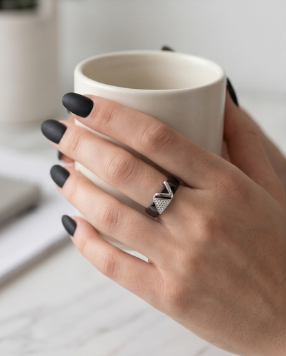 Model wearing Avant black ceramic silver geometric ring with black nails holding mug, Stacked by Jayneebell
