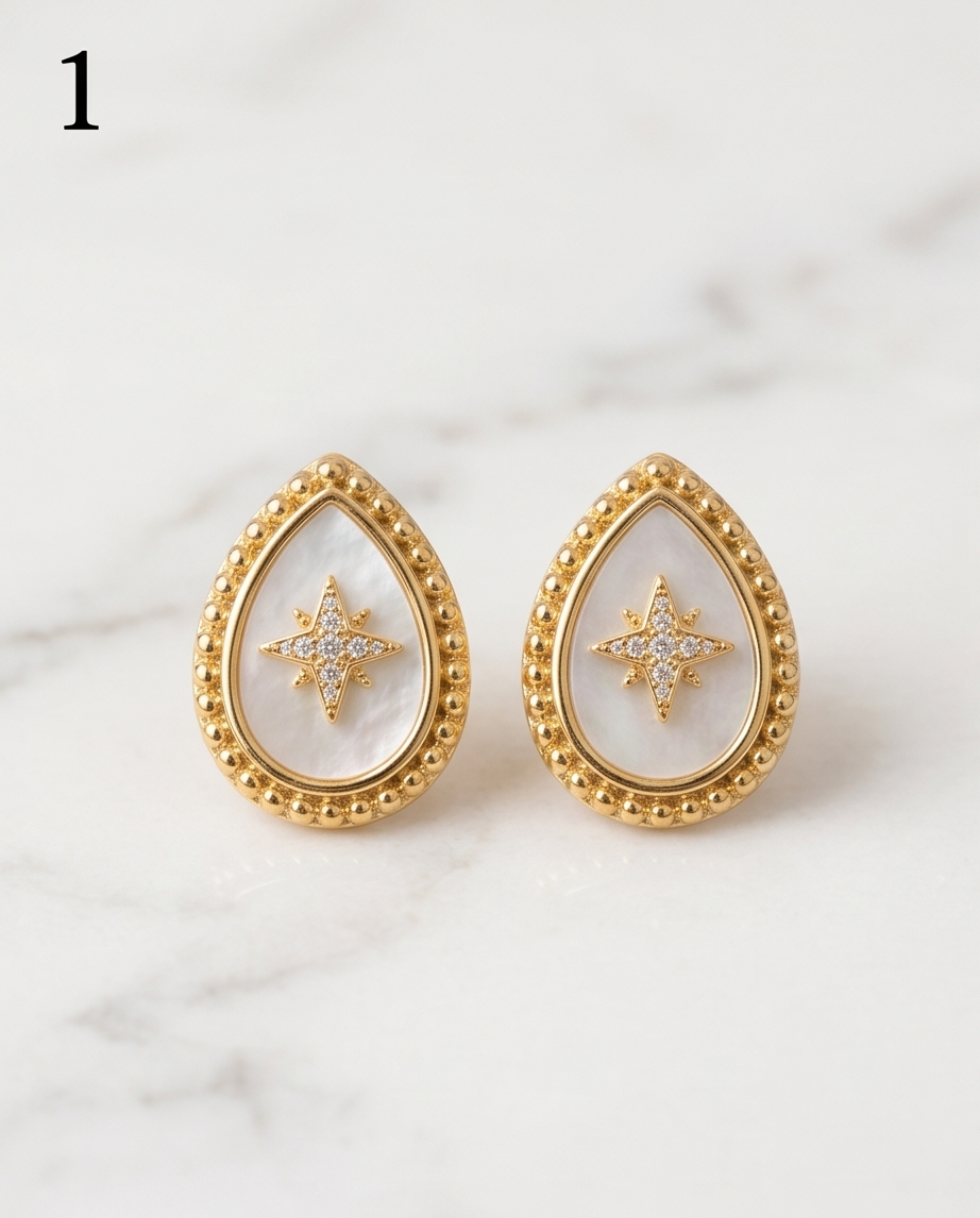 True North mother of pearl gold milgrain teardrop stud earrings with pavé CZ north star on marble, Stacked by Jayneebell
