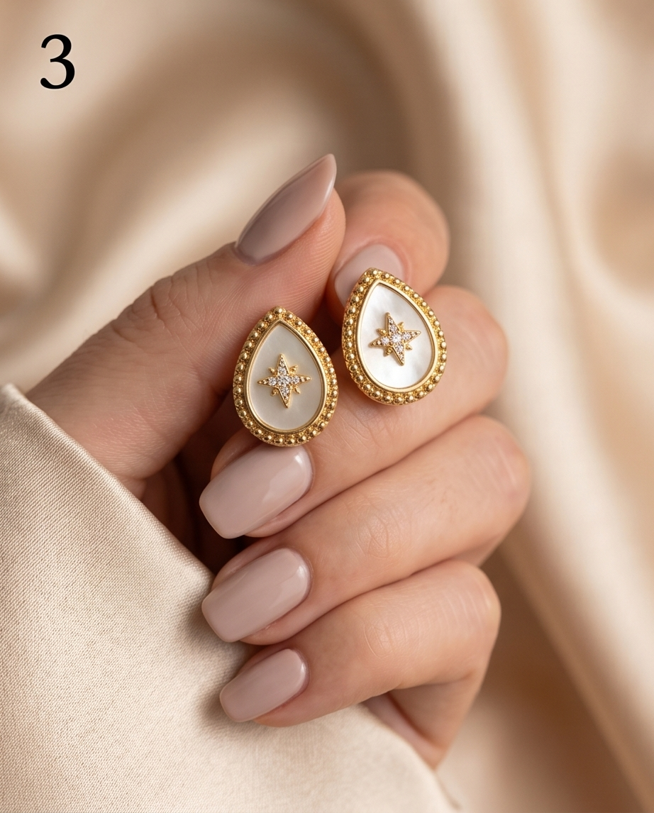 Model holding True North mother of pearl teardrop stud earrings, Stacked by Jayneebell
