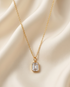 2 carat emerald cut lab diamond pendant on 14k gold filled chain on cream satin — The Luminaire by Stacked by Jayneebell
