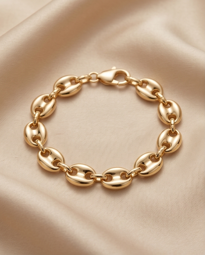 old filled puff mariner oval link bracelet on cream satin — The Puff by Stacked by Jayneebell