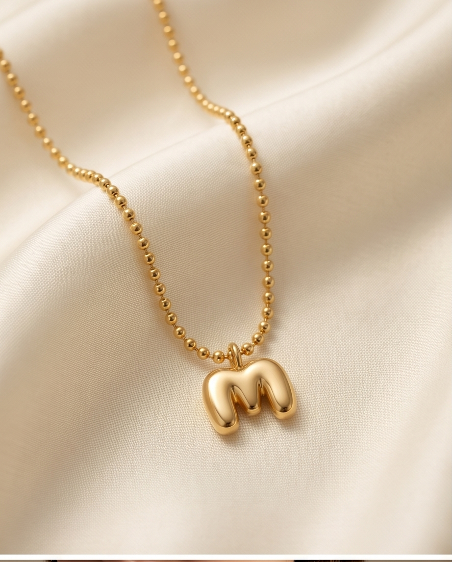 18k gold filled bubble letter M initial necklace on cream satin — Make It Mine by Stacked by Jayneebell
