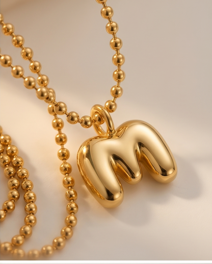18k gold filled bubble letter M initial necklace on cream satin — Make It Mine by Stacked by Jayneebell
