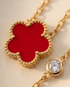 Close-up detail of Très Clove red enamel milgrain flower pendant and CZ station, Stacked by Jayneebell
