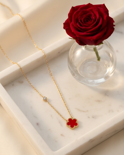 rès Clove rouge enamel flower necklace on marble tray with red rose, Stacked by Jayneebell