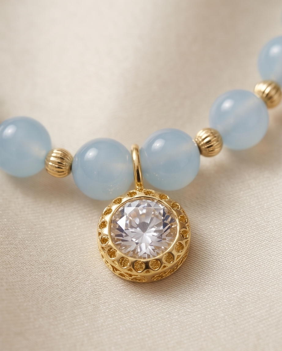 Close up of 2ct cubic zirconia solitaire in gold filled milgrain bezel setting on aquamarine beaded necklace — Stacked by Jayneebell