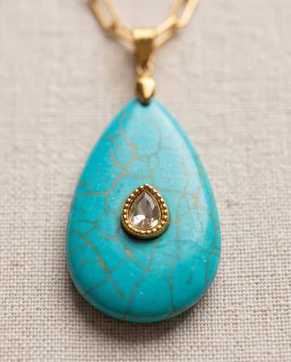 Close-up of The Desert Bloom turquoise pendant with hand-set pavé stone accent, 14k gold filled | Stacked by Jayneebell
