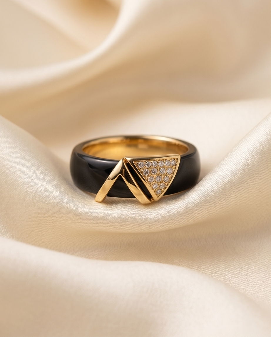 Avant black ceramic ring with gold plated geometric V pavé CZ topper on cream silk, Stacked by Jayneebell
