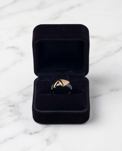 Avant black ceramic gold ring in black velvet gift box on marble, Stacked by Jayneebell