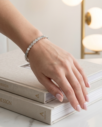 Model wearing The Hive Bangle silver honeycomb bangle bracelet, Stacked