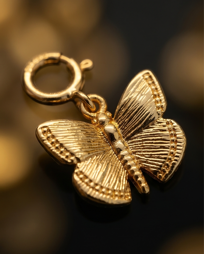Close up detail of gold filled butterfly charm wing texture and spring clasp — Stacked by Jayneebell
