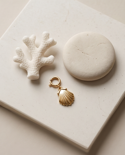 Gold filled seashell convertible charm styled with white coral and stone on tile — She Sells by Stacked by Jayneebell