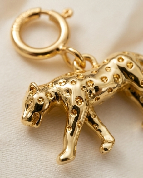 Close up detail of gold filled cheetah charm with spot texture and spring clasp — Stacked by Jayneebell