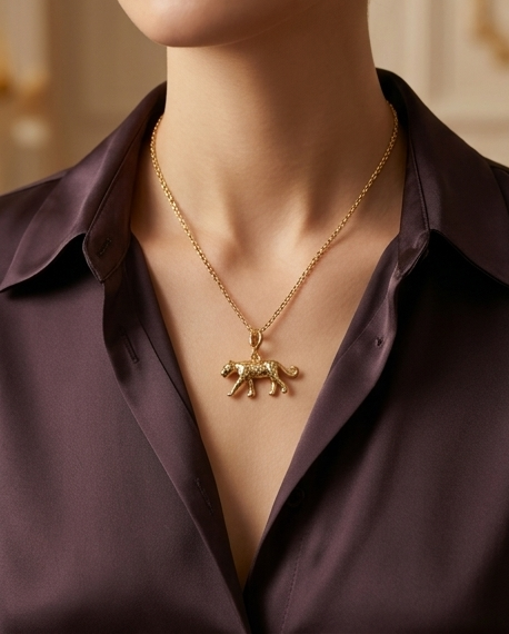 Untamed gold cheetah charm worn as necklace pendant on model — Stacked by Jayneebell