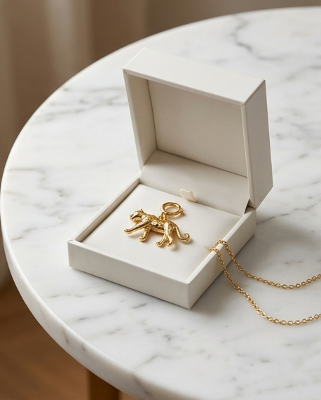 Gold filled cheetah convertible charm in white jewelry box on marble — Untamed by Stacked by Jayneebell