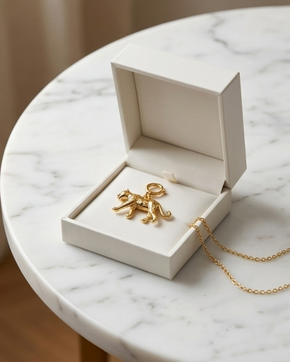 Gold filled cheetah convertible charm in white jewelry box on marble — Untamed by Stacked by Jayneebell