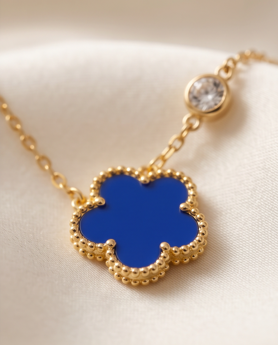Close-up detail of Très Clove cobalt enamel milgrain flower pendant and CZ station, Stacked by Jayneebell