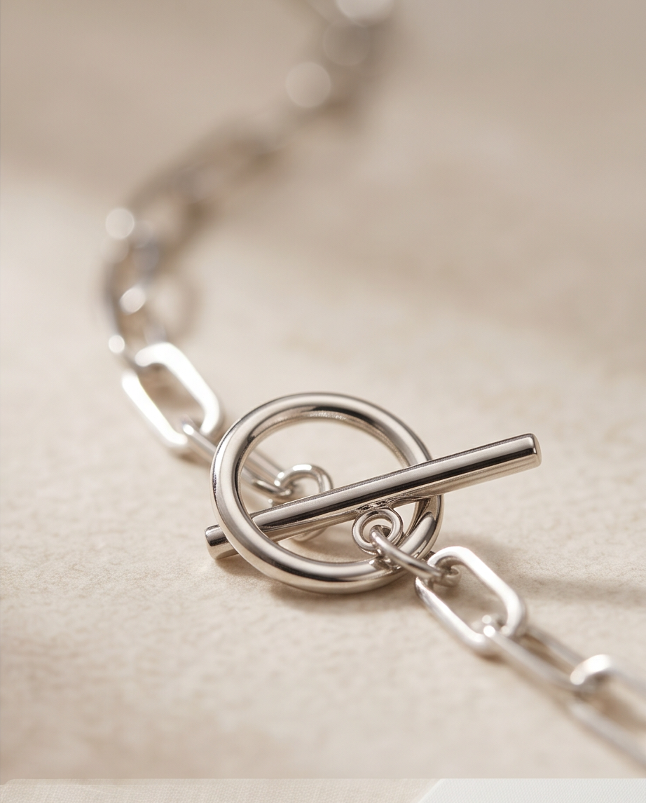 Close-up detail of Bar None silver PVD circle connector and T-bar drop, Stacked by Jayneebell