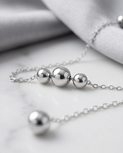 Close-up detail of Silver Lining double ball drop and satellite chain stations, Stacked by Jayneebell