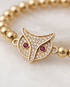 lose up of gold owl charm with crystal detailing on beaded bracelet — Stacked by Jayneebell