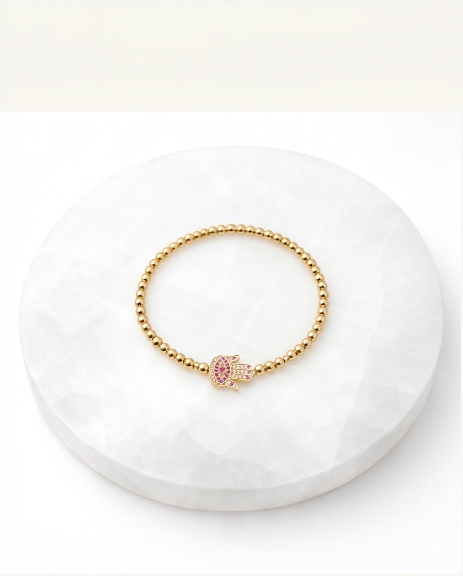 The Hamsa bracelet Rose variant styled flat lay — Stacked by Jayneebell